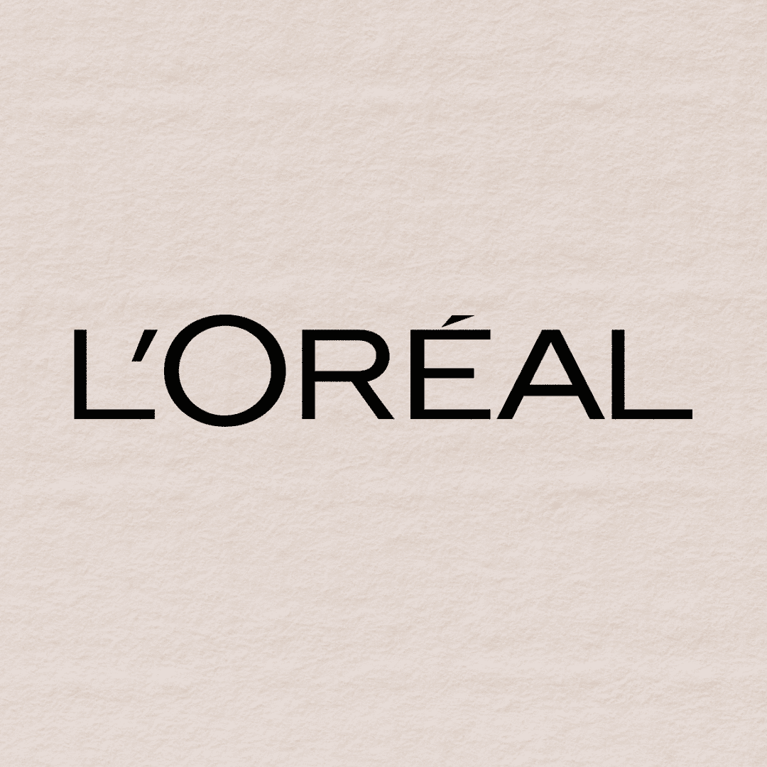 L'Oréal logo on a textured beige background.